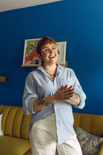 Photographer sitting on a white couch