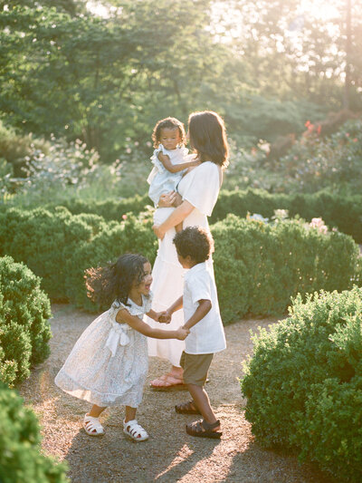 mother and children dancing at delano park by huntsville family photographer fauna & film
