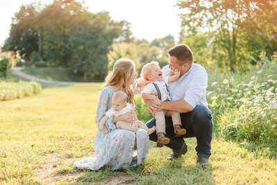 Family laughing with toddler