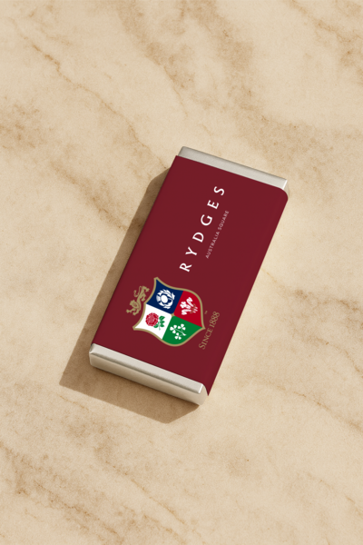 Luxury personalised chocolate bar in rich red British Lions design, created by Barilliant for guests staying at Rydges Hotel Sydney.