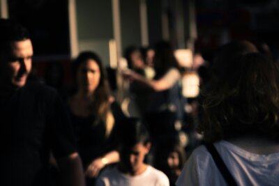 Person in a group of people feeling anxious