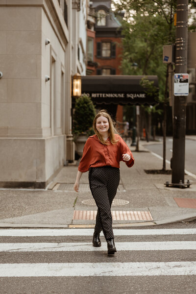 Picture of Lydon (small business owner) crossing the street near Rittenhouse Square