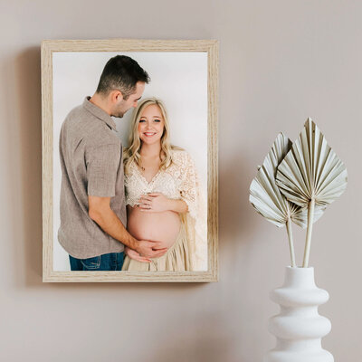 wood framed photo of pregnant couple in Joplin MO maternity photographer The XO Photography