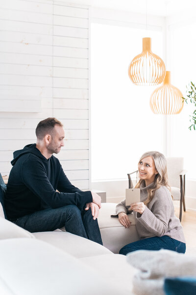Man and women working through question cards together