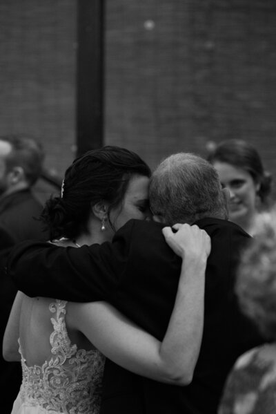 Bride hugging her father
