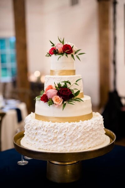 Four tier wedding cake with florals