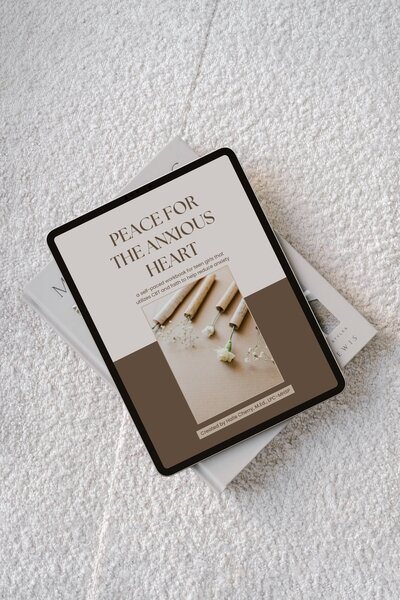 iPad with digital workbook titled "Peace for the Anxious Heart" on a cozy surface, representing self-paced, faith-integrated counseling resources for women and girls
