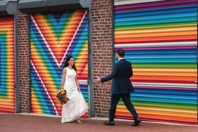 a couple walks towards each other on their wedding day. 