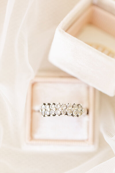 scalloped wedding ring in a blush pink ring box