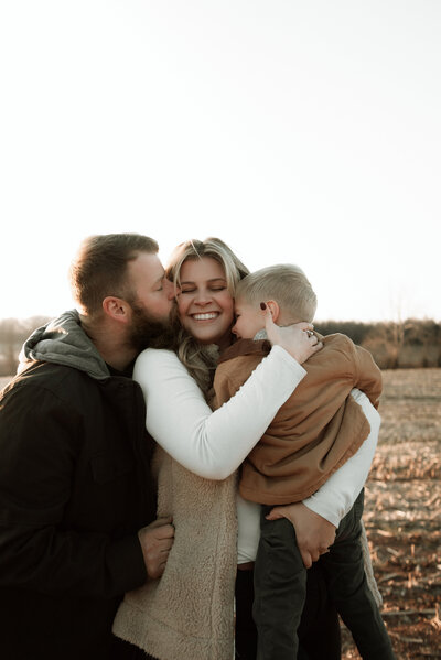 carly hudson with family in field in westminster maryland as a wedding and elopement photographer