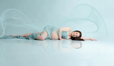 Pregnant woman in gown for maternity shoot in orlando