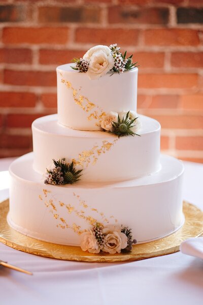 classic 3 tiered wedding cake with gold foiling