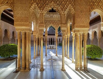 The intricate Moorish arches and carved stucco details of the Court of the Lions at the Alhambra in Granada ©Stephanie Dosch | theViatrix Spain Private Luxury Travel