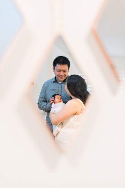 In-home lifestyle Newborn Photo session, sibling love, taken in Irvine, California