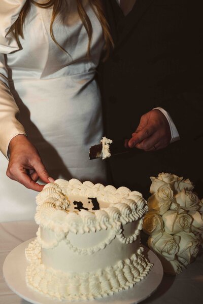 Cake cutting at a luxury wedding venue in Kent with direct flash