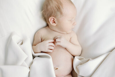 A newborn baby sleeps soundly.