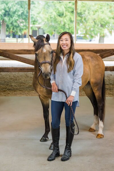 woman equestrian business owner branding session at barn