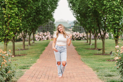 senior girl sitting on a bench showing composition for people who want photographer education or a mentorship by lancaster pa photographer