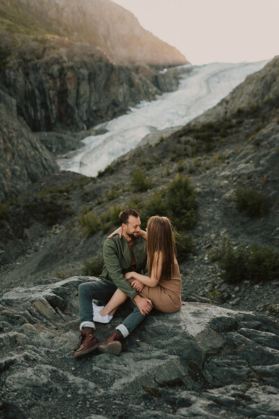 couple embracing on glacier overlook