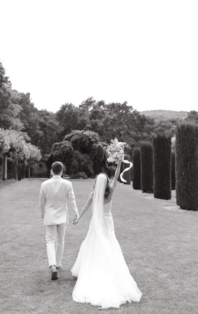 Bride and groom walking away - about us wedding planner event planner
