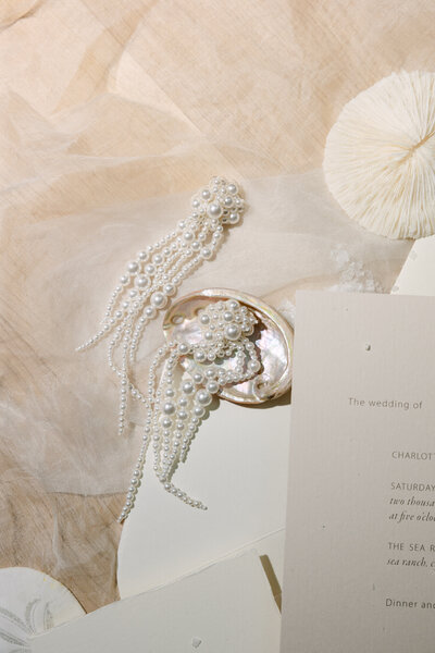 person kisses the cheek of their parter who is smiling sweetly