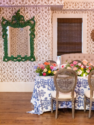 indoor wedding reception in a fun and colorful vintage style room