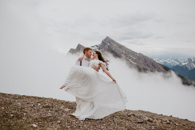 Couple dancing on top of a mountain in Kananaskis