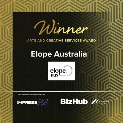 The team at Elope receiving an award on stage