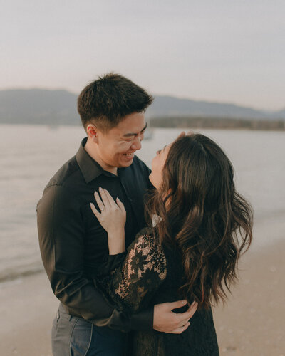 Couple embracing in front of beach