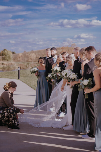 wedding photographer posed with bride