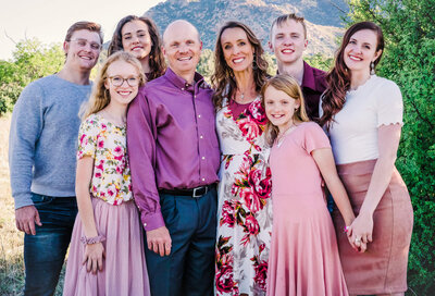 Family poses in front of Granite Mountain for Prescott Family photographer Melissa Byrne