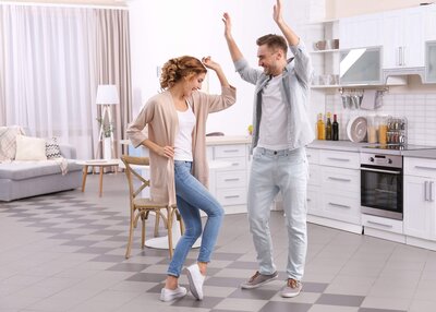 Couple dancing in kitchen
