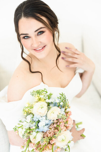 Bride twirls her dress at The Olana Wedding Venue in Hickory Creek, Texas/