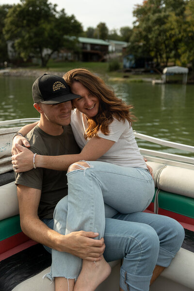 Midwest couple cuddling on a pontoon boat