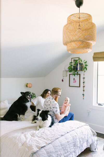 Documentary lifestyle photo of family on bed