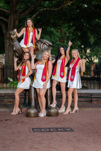 A group of University of South Carolina students, celebrating their graduation at their senior portrait session with their senior photographer, Lyndsey Livingston