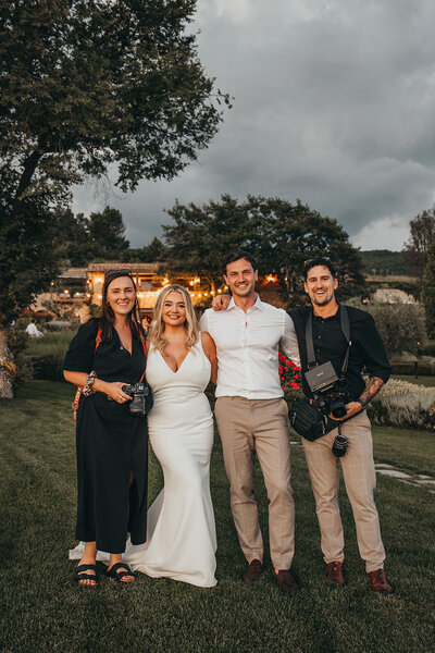Amy and Nick pose with bride and groom 