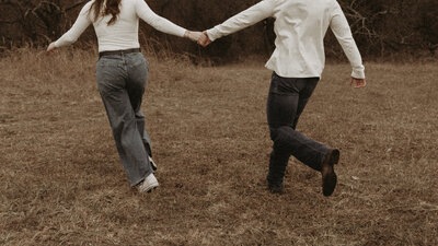 Couple dances in the shadows under a gazebo in Northeast Kansas City, Missouri.