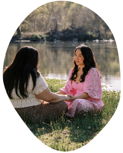 Joanne Lai standing by a river after somatic therapy