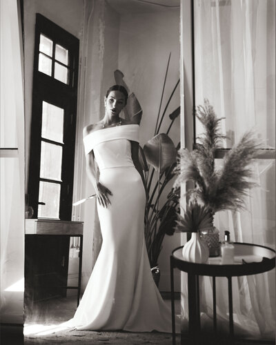 A bride standing in a full length mirror at The Firehouse venue in NC.