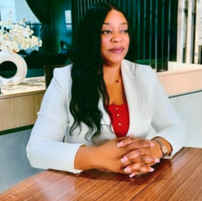black male in suite and bow tie headshot
