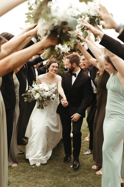 Wedding sendoff shot in the garden with their bridesmaids and groomsmen