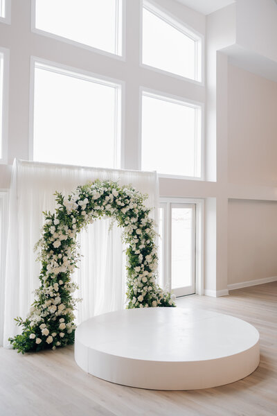 Bride smiles at Groom while saying their vows at the Lincoln, NE Wedding Venue, Arbor Day Farms. Photo by Lincoln NE Wedding Photographer, Anna Brace.
