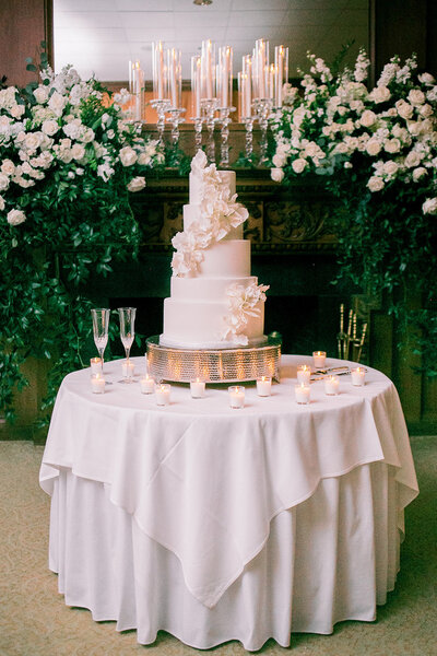 luxury cake design with champagne glasses and votive candles