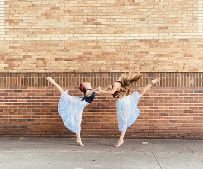 Two young B. Box dancers posing in front of the studio