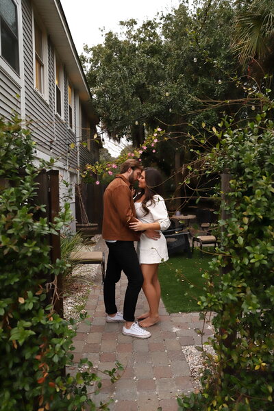 Couple  holding each other during their backyard lifestyle photo shoot