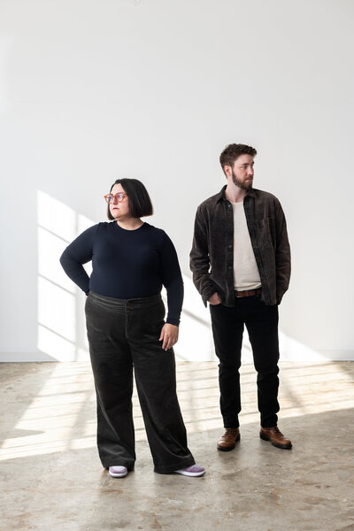 Sydney and Will standing in bright room 