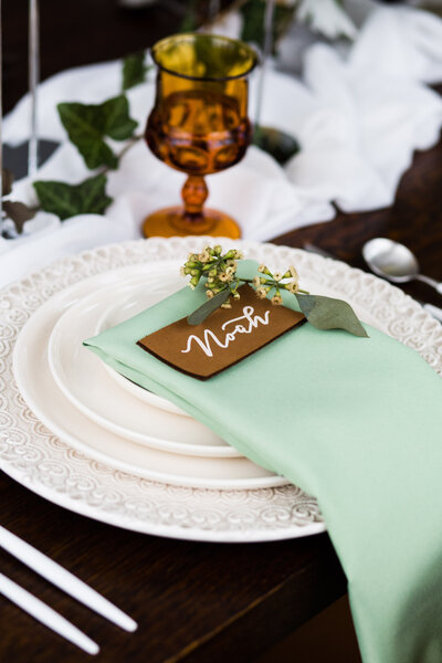 Leather place card with white lettering for New Haven. Connecticut event