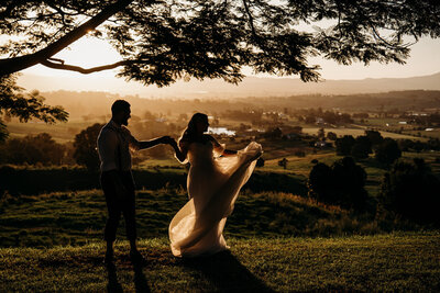 bride and top of hill at sunset