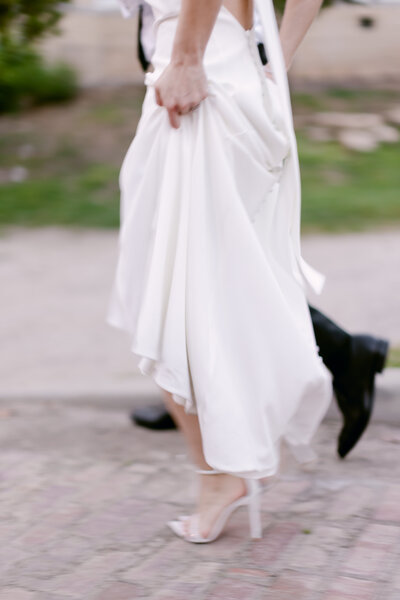 Motion blurred image of a bride and groom walking